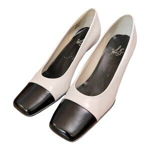 Black and white pointed high-heeled shoes